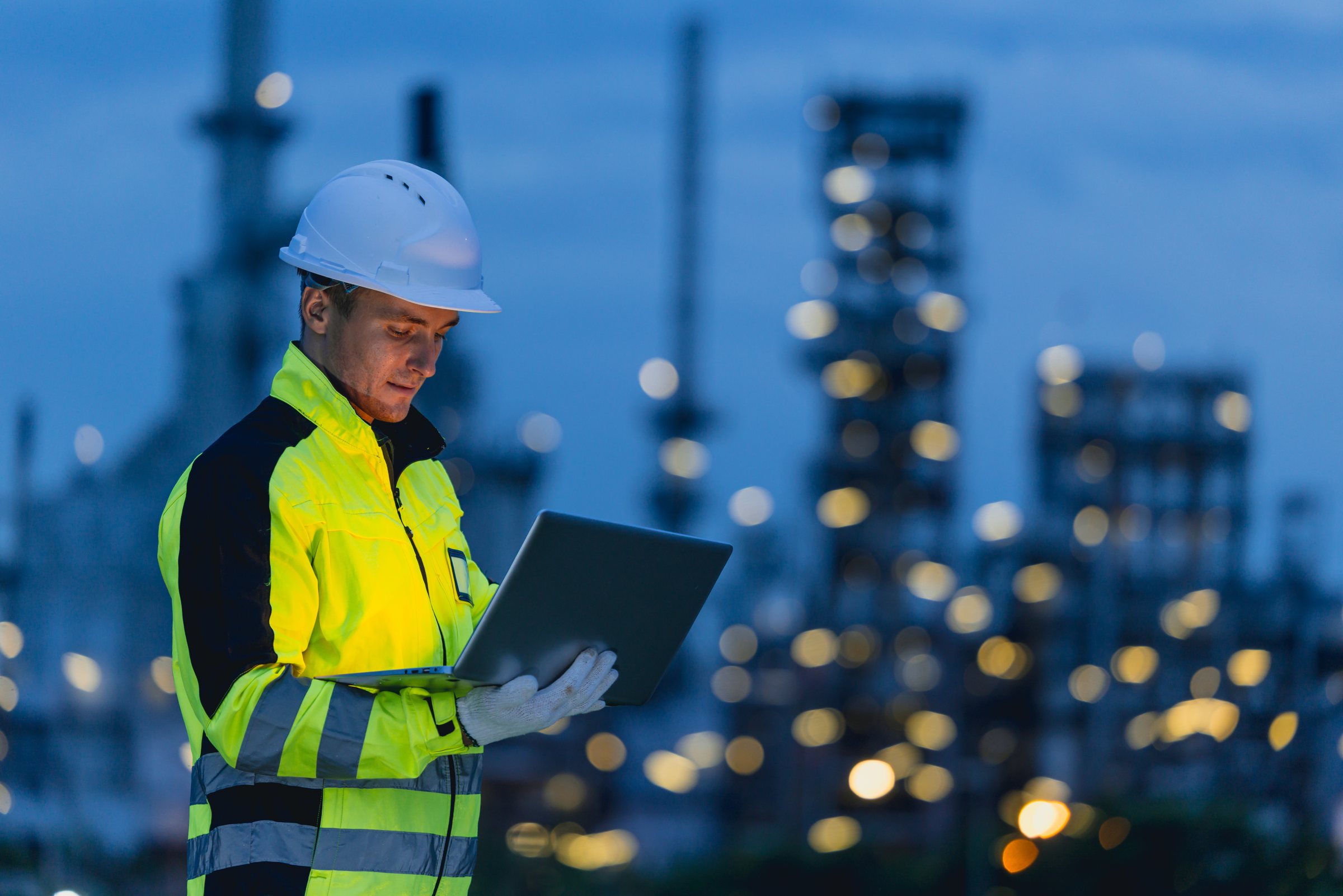 LUX field engineer at an energy site at dusk